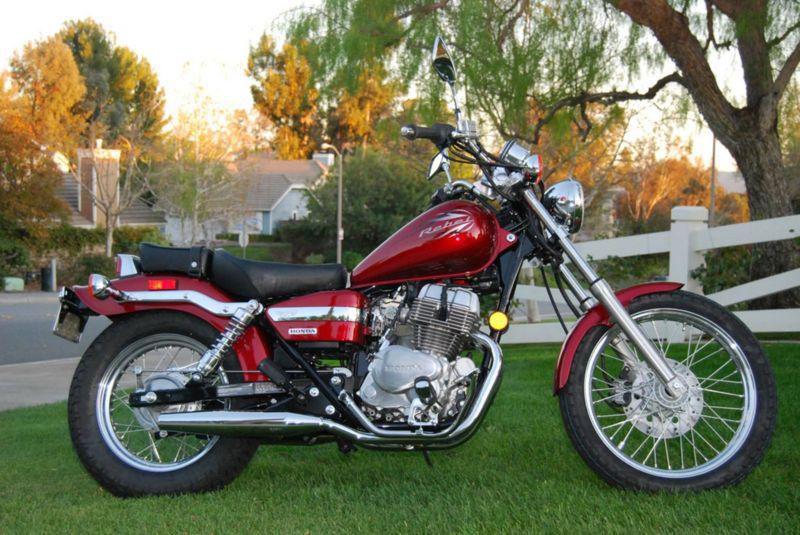 Only 20 miles on this beautiful candy apple red Honda Rebel.