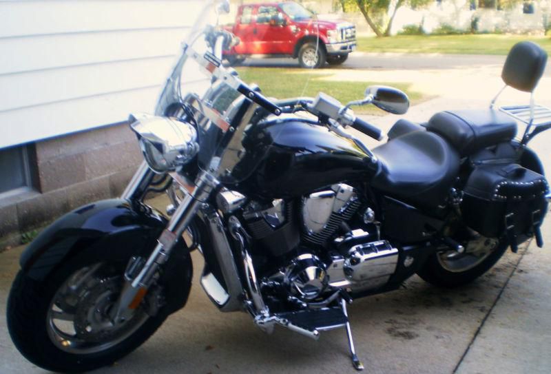 Black Honda VTX1800 in great condition with bags, windshield and back rest