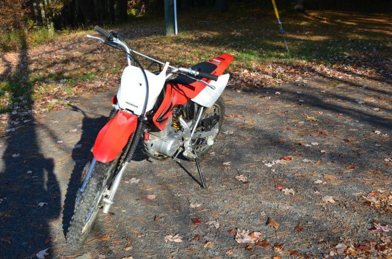 Honda off road used crf 100 riding gear dirt bike out doors red motorcycle